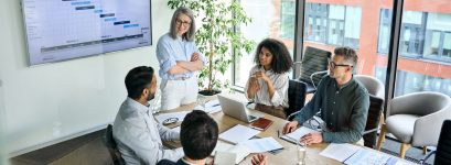 Senior,Female,Ceo,And,Multicultural,Business,People,Discussing,Company,Presentation